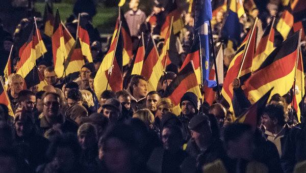 almaniyada-kutlevi-etiraz-aksiyalari-kecirilib