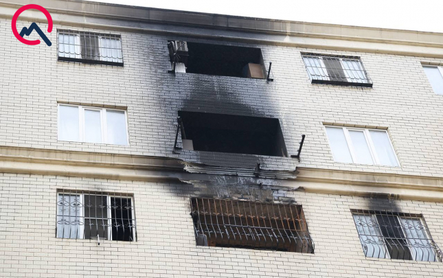 yanginda-olenlerden-biri-komeye-gelen-qonsu-imis